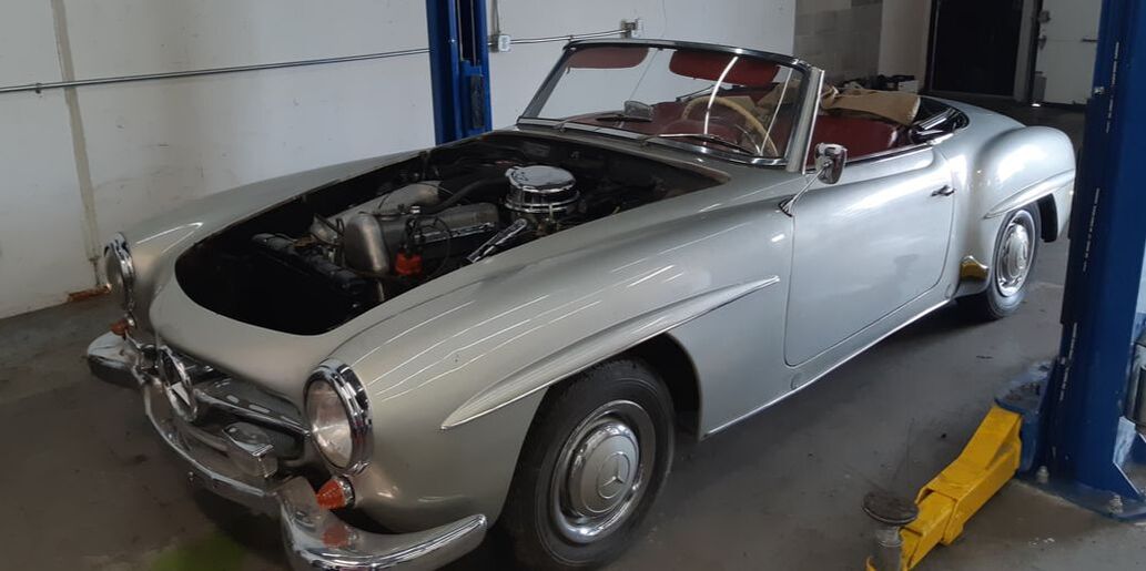 grey 1961 Mercedes-Benz 190 SL in shop